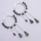 Yellow Turquoise and Hematite Wire-wrapped Hinged Hoop Dangle Sterling Silver Earrings shown from above on flat white surface