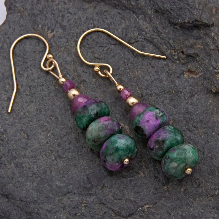 Ruby and Ruby Zoisite Gold Filled Stack Earrings shown from above, laid flat on dark grey stone
