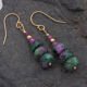 Ruby and Ruby Zoisite Gold Filled Stack Earrings shown from above, laid flat on dark grey stone