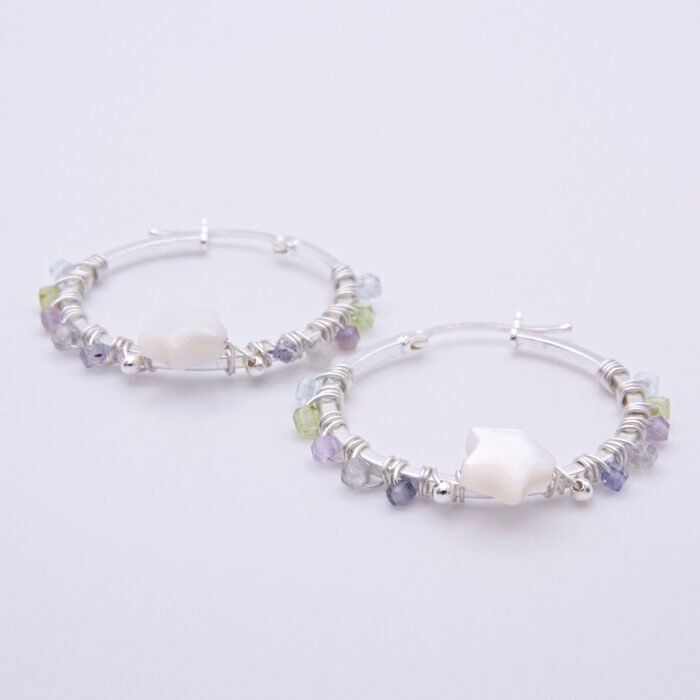 Mother of Pearl Star and mixed gemstone wire wrapped hinged hoop Sterling Silver Earrings Mother of Pearl Star and mixed gemstone wire wrapped hinged hoop Sterling Silver Earrings lying flat on plain white surface with focus on Mother of Pearl Star