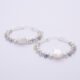Mother of Pearl Star and mixed gemstone wire wrapped hinged hoop Sterling Silver Earrings Mother of Pearl Star and mixed gemstone wire wrapped hinged hoop Sterling Silver Earrings lying flat on plain white surface with focus on Mother of Pearl Star
