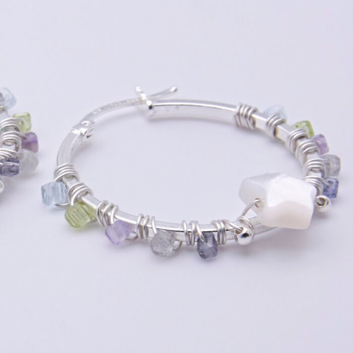 Mother of Pearl Star and mixed gemstone wire wrapped hinged hoop Sterling Silver Earrings Mother of Pearl Star and mixed gemstone wire wrapped hinged hoop Sterling Silver Earrings close up of single earring on flat white surface
