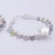 Mother of Pearl Star and mixed gemstone wire wrapped hinged hoop Sterling Silver Earrings Mother of Pearl Star and mixed gemstone wire wrapped hinged hoop Sterling Silver Earrings close up of single earring on flat white surface