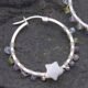 Mother of Pearl Star and mixed gemstone wire wrapped hinged hoop Sterling Silver Earrings Mother of Pearl Star and mixed gemstone wire wrapped hinged hoop Sterling Silver Earrings second single earring laid on grey stone