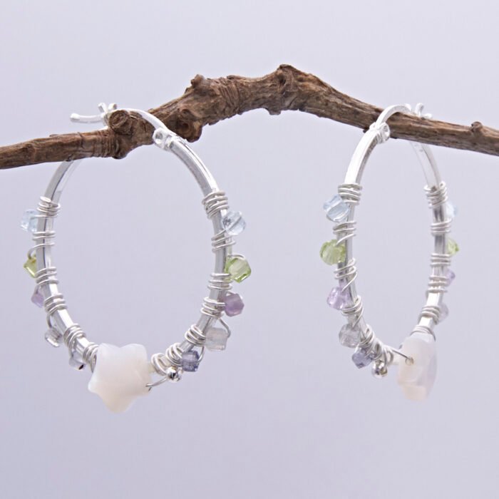 Mother of Pearl Star and mixed gemstone wire wrapped hinged hoop Sterling Silver Earrings Mother of Pearl Star and mixed gemstone wire wrapped hinged hoop Sterling Silver Earrings shown spaced apart hanging from twig