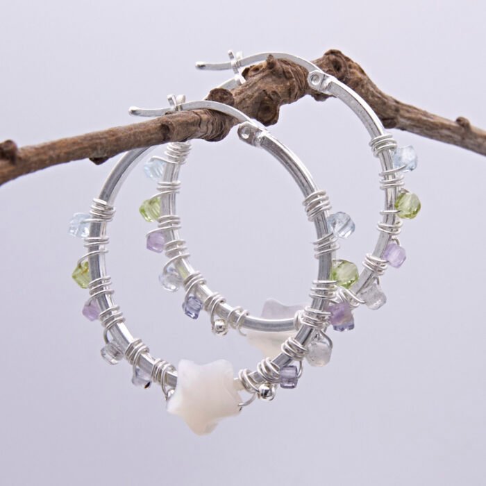 Mother of Pearl Star and mixed gemstone wire wrapped hinged hoop Sterling Silver Earrings Mother of Pearl Star and mixed gemstone wire wrapped hinged hoop Sterling Silver Earrings shown hanging from a twig