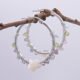 Mother of Pearl Star and mixed gemstone wire wrapped hinged hoop Sterling Silver Earrings Mother of Pearl Star and mixed gemstone wire wrapped hinged hoop Sterling Silver Earrings shown hanging from a twig