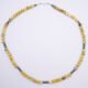 Yellow Turquoise and Hematite Gemstone Bead Necklace with Hook and Eye Clasp, shown from above on flat white surface