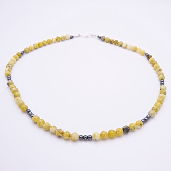 Yellow Turquoise and Hematite Bead Necklace shown on flat white surface
