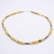 Yellow Turquoise and Hematite Bead Necklace shown on flat white surface