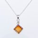 Carnelian Square Cabochon Sterling Silver Pendant Necklace close up of Carnelian pendant and bail on chain laid flat on white surface
