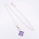 Amethyst Square Cabochon Sterling Silver Pendant Necklace laid flat on white surface