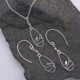 Sterling Silver Robin on Branch Pendant Necklace and Earrings set Sterling Silver Robin on Branch Pendant Necklace and Earrings set shown laid flat on dark grey stone