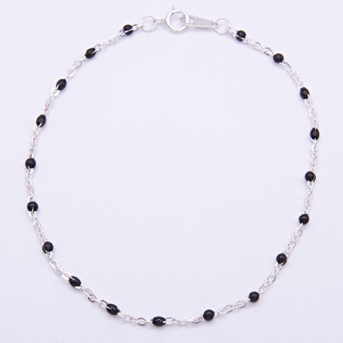 Black Enamel Bead Sterling Silver Bracelet shown viewed from above on flat white background