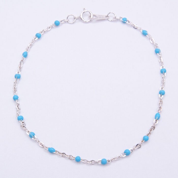 Turquoise Enamel Bead Sterling Silver Chain Bracelet shown viewed from above on plain white background