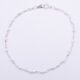 White Enamel Bead Sterling Silver Bracelet shown viewed from above on plain white background