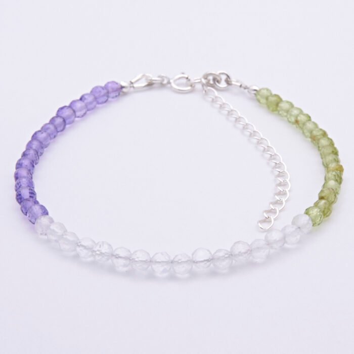 Genderqueer Flag Colours Amethyst, Crystal Quartz and Peridot Gemstone Bracelet with Sterling Silver clasp and extender chain, viewed from the front, laid flat on plain white background