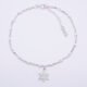 Sterling Silver and White Enamel Bead Bracelet with Sterling Silver Snowflake Charm shown viewed from above on plain white background