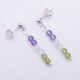 Sterling Silver Stud Earrings with Mixed Gemstone Dangles in Amethyst, Crystal Quartz and Peridot shown laid flat on white surface