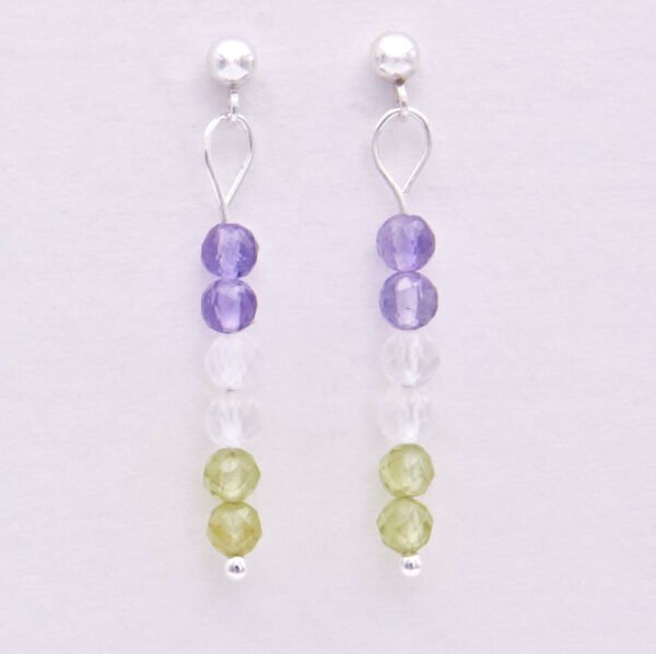 Sterling Silver Stud Earrings with Mixed Gemstone Dangles in Amethyst, Crystal Quartz and Peridot representing the colours of the Genderqueer Flag, shown hanging from white display card