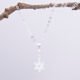 Sterling Silver Snowflake Charm Necklace, image shows necklace suspended from twig with plain white background
