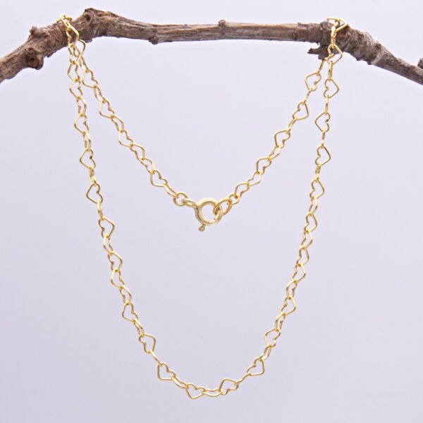 Gold Filled Heart Link Chain Anklet shown hanging from twig