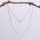 Tiny Hearts Gold Filled Ankle Chain shown hanging from twig