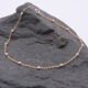 Gold Filled and Sterling Silver Chain Bracelet Gold Filled and Sterling Silver Chain Bracelet shown on dark grey stone
