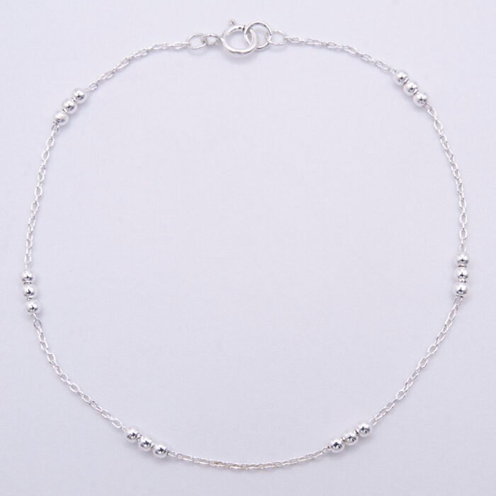 Sterling Silver Three Bead Chain Bracelet Sterling Silver Three Bead Chain Bracelet shown viewed from above on plain white background