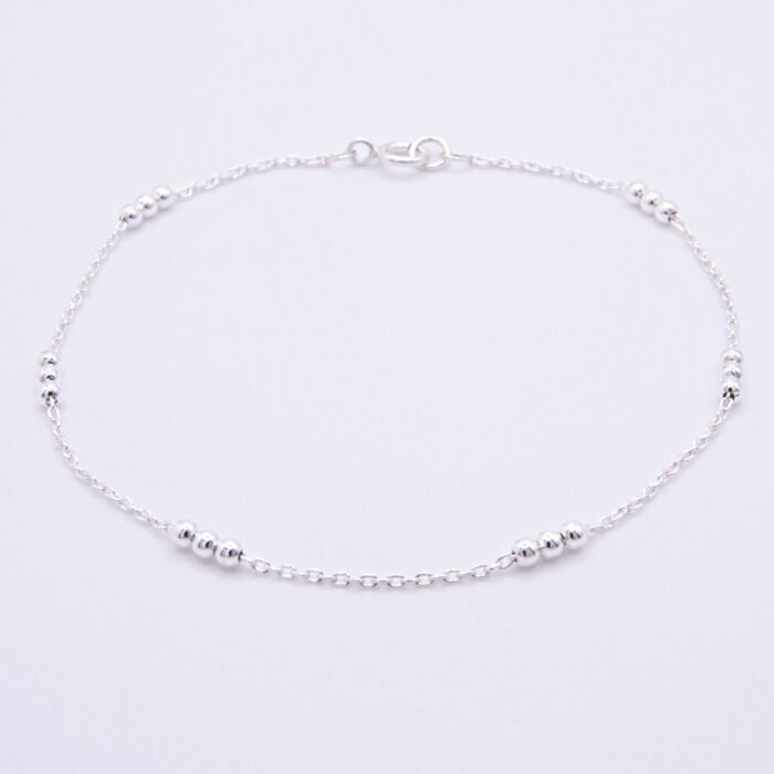 Sterling Silver Three Bead Chain Bracelet Sterling Silver Three Bead Chain Bracelet shown on a flat white surface