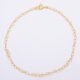 Gold Heart Link Chain Bracelet shown viewed from above on plain white background