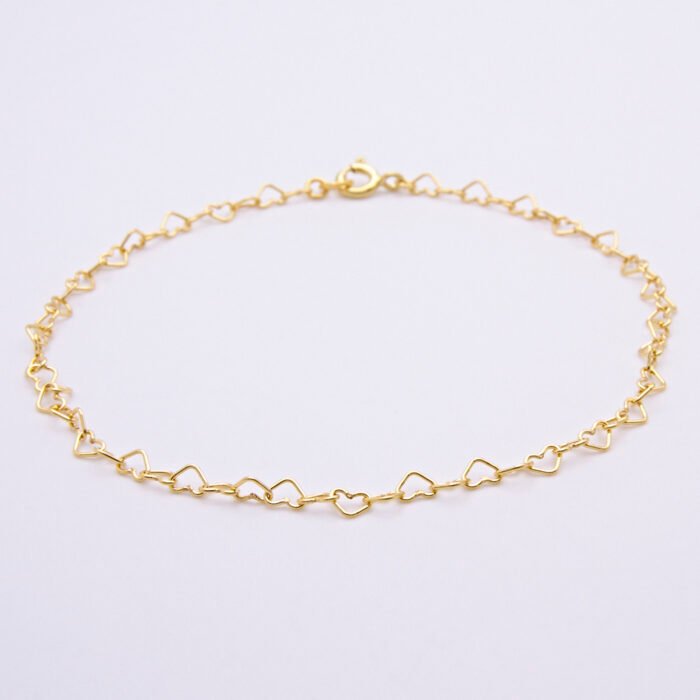 Gold Heart Link Chain Bracelet shown laid flat on plain white background