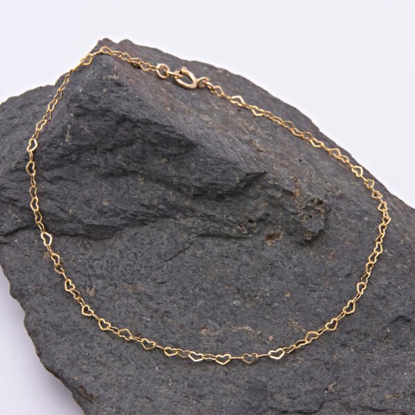 Tiny Gold Filled Heart Link Chain Bracelet shown displayed on dark grey stone