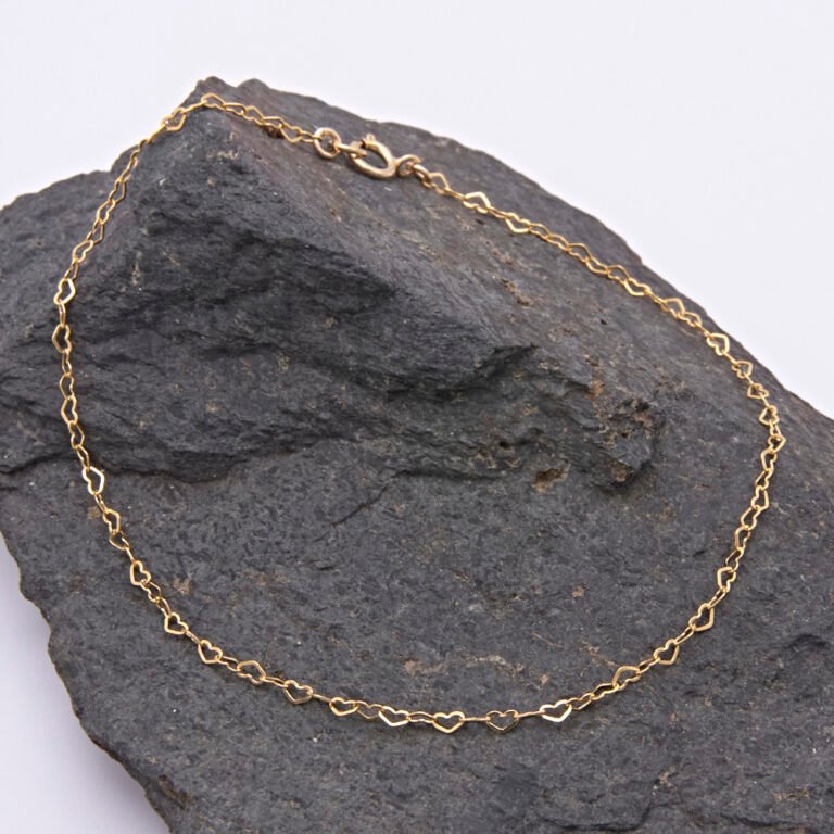 Tiny Gold Filled Heart Link Chain Bracelet shown displayed on dark grey stone