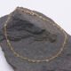 Tiny Gold Filled Heart Link Chain Bracelet shown displayed on dark grey stone