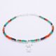 Green Onyx, Carnelian and Sapphire Sterling Silver Bracelet with Sterling Silver Cocktail Charm in the centre, image shows bracelet laid flat on white surface with charm front and centre