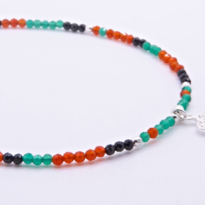 Green Onyx, Carnelian and Sapphire Sterling Silver Bracelet with Sterling Silver Cocktail Charm in the centre, image shows close up of central portion of bracelet with charm, on plain white background