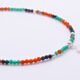 Green Onyx, Carnelian and Sapphire Sterling Silver Bracelet with Sterling Silver Cocktail Charm in the centre, image shows close up of central portion of bracelet with charm, on plain white background