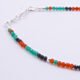 Green Onyx, Carnelian and Sapphire Sterling Silver Bracelet with Sterling Silver Cocktail Charm in the centre, image shows close-up of some of the beading and the clasp, on a plain white background