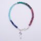 Mixed Gemstone Bracelet with Sterling Silver Cocktail Charm shown from above on plain white background with charm and clasp at the bottom of image