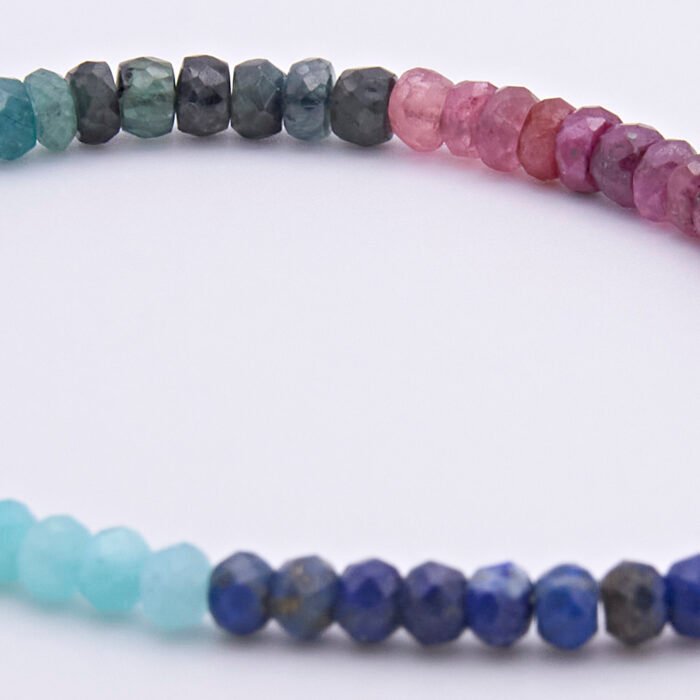 Mixed Gemstone Bracelet with Sterling Silver Cocktail Charm, image shows close up of sapphires, rubies and emeralds
