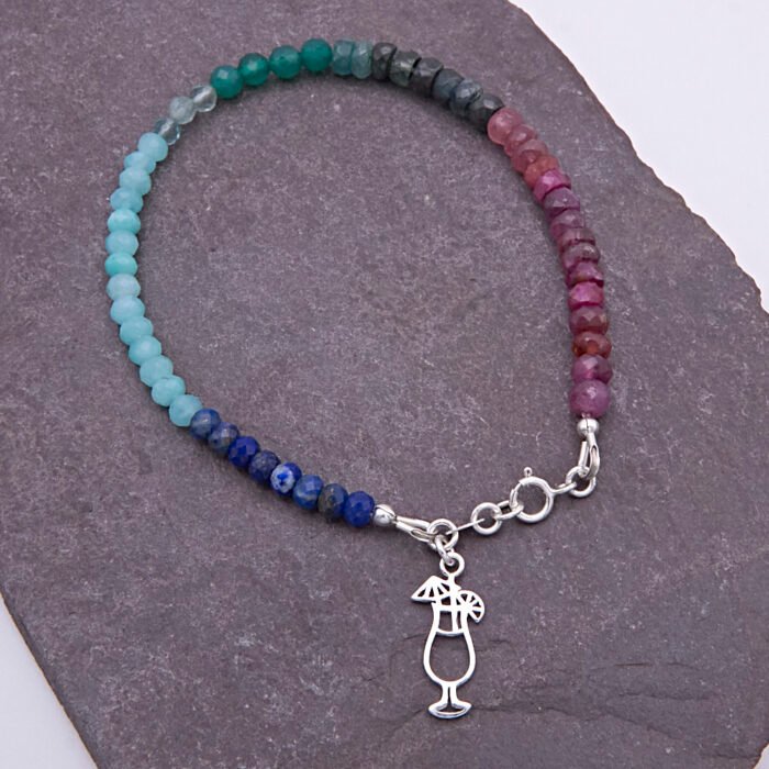 Mixed Gemstone Bracelet with Sterling Silver Cocktail Charm shown from above on dark slate