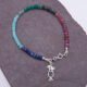 Mixed Gemstone Bracelet with Sterling Silver Cocktail Charm shown from above on dark slate