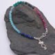 Mixed Gemstone Bracelet with Sterling Silver Cocktail Charm shown on dark slate
