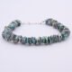 Green Keishi Cornflake Freshwater Pearl and Sterling Silver Bracelet, shown viewed from the front on plain white background