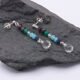 Mixed Gemstone Dangle Earrings on Sterling Silver posts sshown viewed from the side on dark grey stone