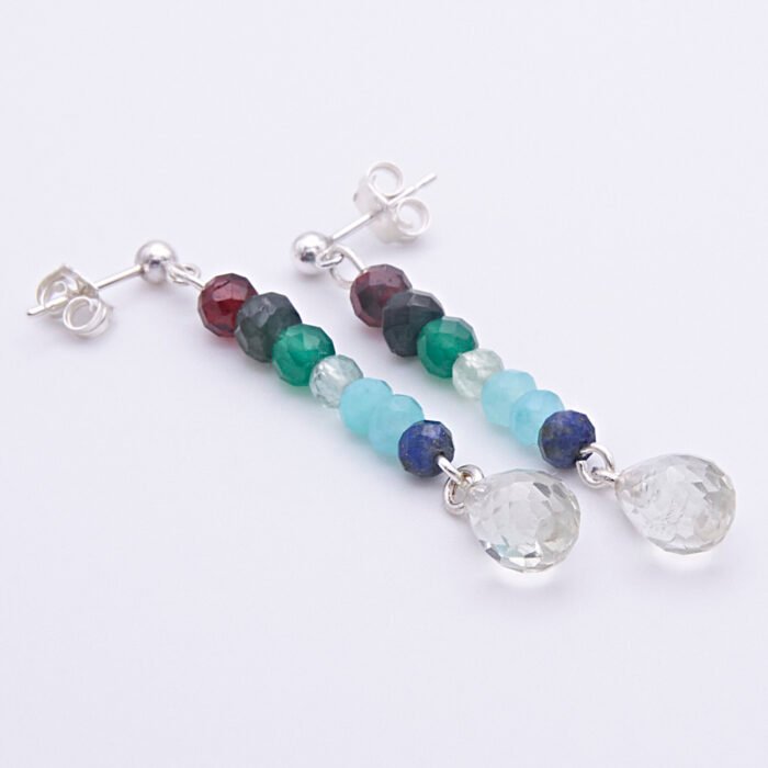 Mixed Gemstone Dangle Earrings on Sterling Silver posts shown laid flat on a white background at an angle with posts at the top and amethyst teardrops at the bottom