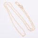 Gold Filled Tiny Hearts Chain Necklace shown viewed from above on plain white background, chain arranged in an N shape
