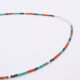 Green Onyx, Carnelian and dark blue Sapphire gemstone necklace with silver clasp, image shows part of necklace with clasp to the right, on plain white background