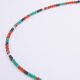 Green Onyx, Carnelian and dark blue Sapphire gemstone necklace with silver clasp, image shows close-up of a beaded section on plain white background